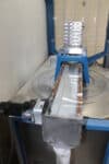 Custom CAM stack with conveyor belt
